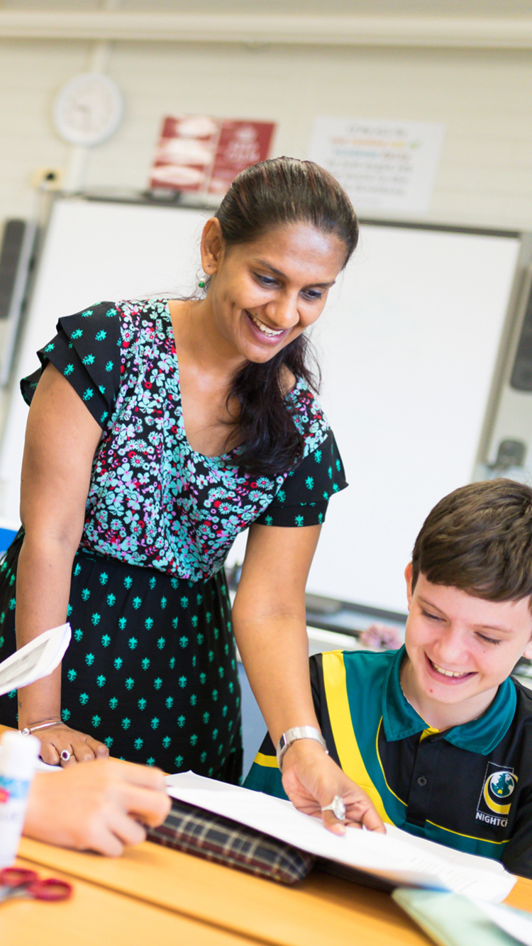 Students and trainee teacher in classroom
