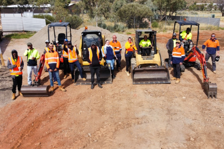 students standing with machinery