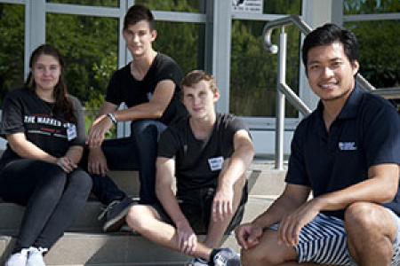 Students embrace science. From left: Crystal Lenegan-Dry, Johannes du Plessis and Noah Hanrahan with PICSE-CDU Science Education Officer John Sagun
