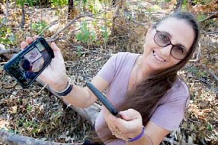 Research fellow Marianne St Clair shows how her smartphone can be used as a diagnostic tool