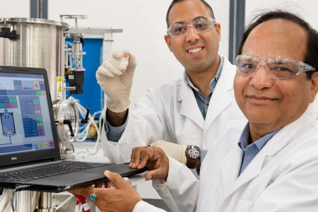 Hooman Mehdizadeh Rad showing the NT’s first organic solar cell with Professor Jai Singh AM.
