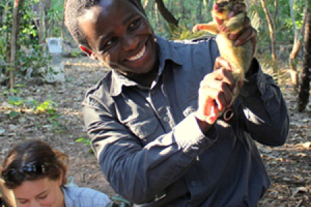 CDU Conservation and Land Management student Comfort Ncube holds a northern brushtail possum at the Territory Wildlife Park. CDU VET lecturer Thalie Partridge (left) records data. Photographer: Damien Stannioch