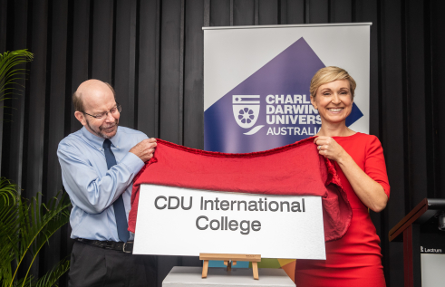 CDU Vice Chancellor Prof Simon Maddocks unveils the CDU international College plaque with UP Education CEO of University Partnership's Marnie Watson.