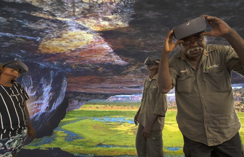 Arafura Swamp Rangers Aboriginal Corporation members Erica Ngurruwuthun, David Bidingal and Charlie Ramandjarri test out the virtual reality technology at CDU. Virtual reality image courtesy of Injalak Arts.