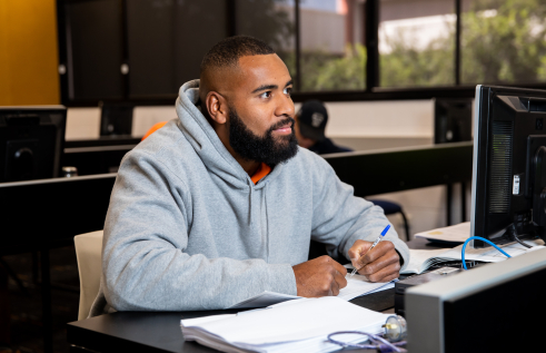 Male student sitting in a classroom
