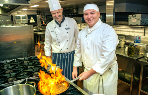 Darwin local and Charles Darwin University (CDU) Certificate III in Commercial Cookery student Stellio Ginis is putting his cooking skills to the test as he prepares to represent Australia at the Culinary Olympics in 2024. Pictured; Stellio Ginis CDU Senior VET Lecturer in Culinary Arts Jason Wilkes