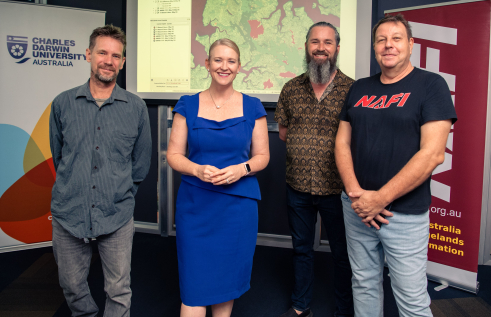 New funding will look to develop satellite fire mapping tech to help manage what happens on the ground. Pictured L-R CDU Research Dr Rohan Fisher, Minister for Industry Nicole Manison, NAFI Developer Tom Lynch and CDU spatial software engineer Dr Patrice Weber.