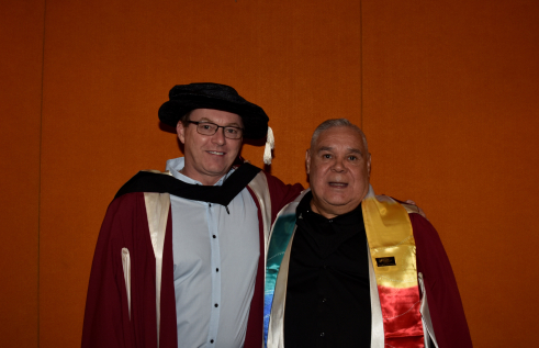 two male researchers pose for camera